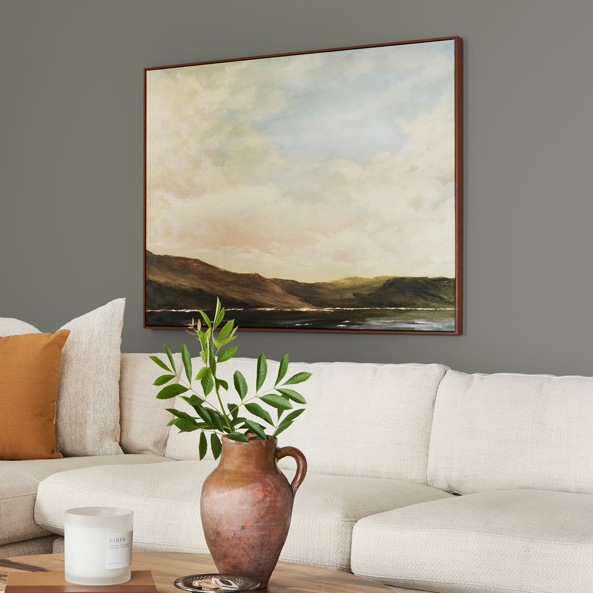Sage green with gray undertones interior paint named estate shown painted on living room wall