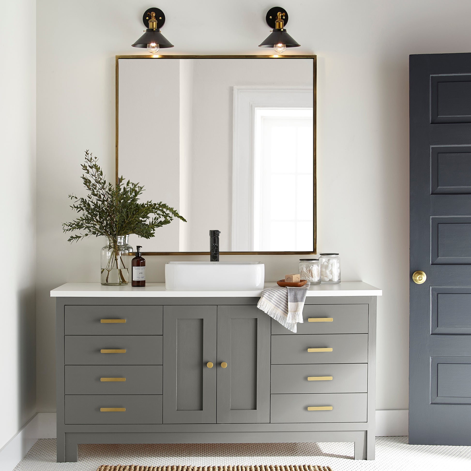 A deep sage with a soft gray undertone door and cabinet paint named estate shown painted on bathroom cabinet