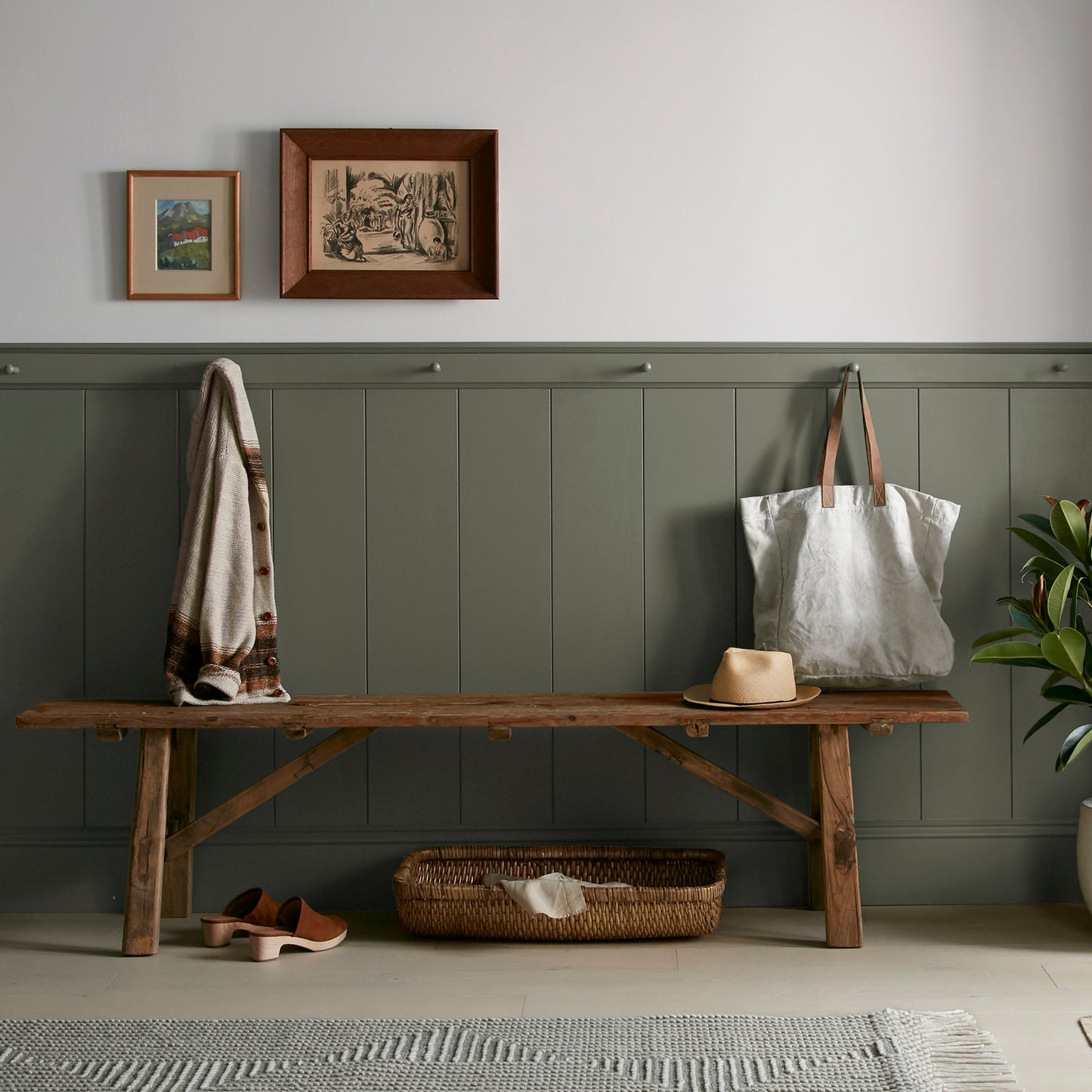 deep olive green interior paint named Step Stool Green shown painted on entryway wall