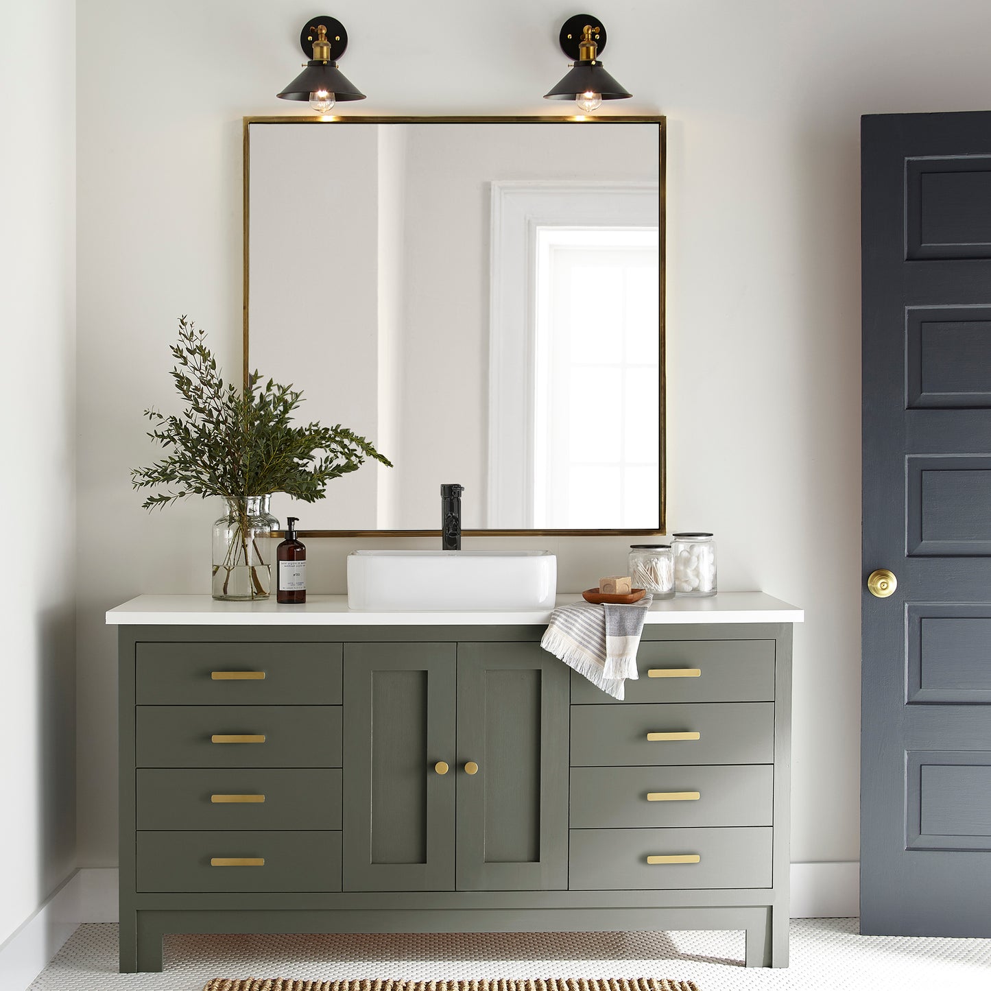A lively, deep olive door and cabinet paint named step stool green shown painted on bathroom cabinet