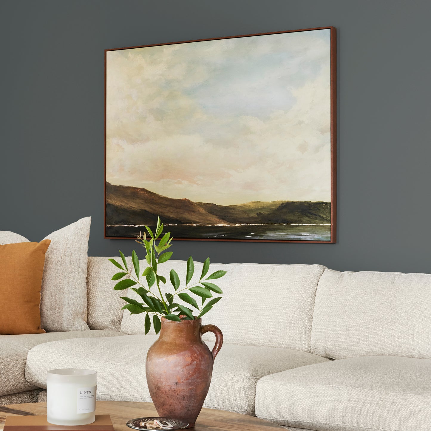 moody navy infused with deep green interior paint named cottage grove shown painted on living room wall