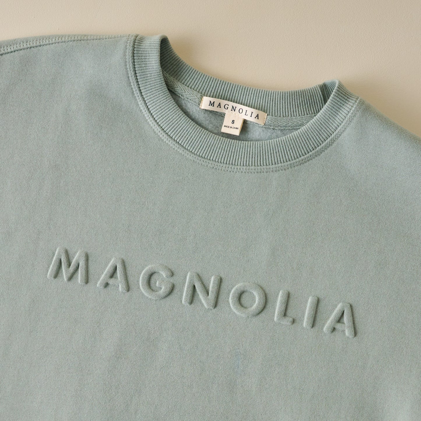 Magnolia Embossed Green Brushed Fleece Sweatshirt up close