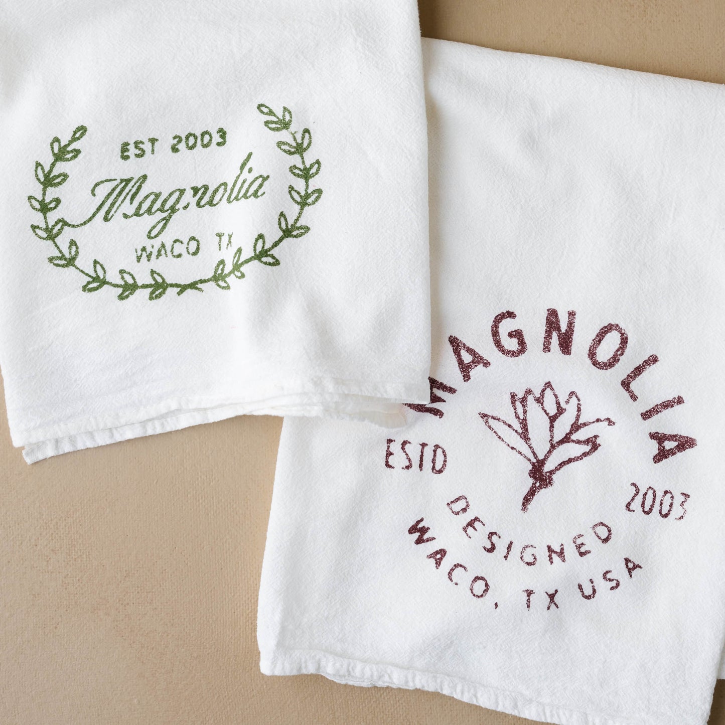 Magnolia Sage Laurel Wreath Tea Towel with another magnolia tea towel