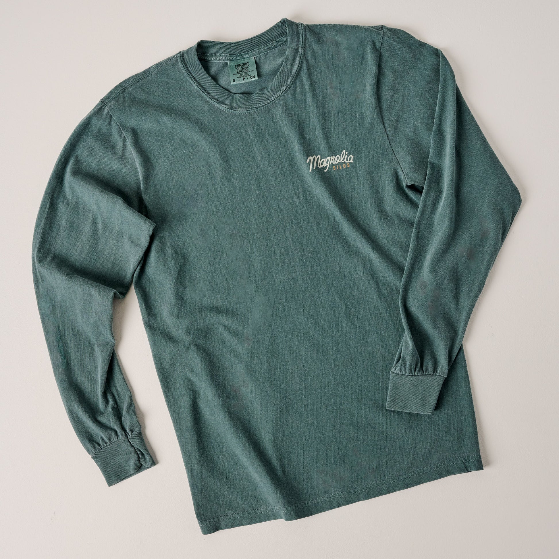 Front of Magnolia Script Silos Blue Spruce Long Sleeve Shirt