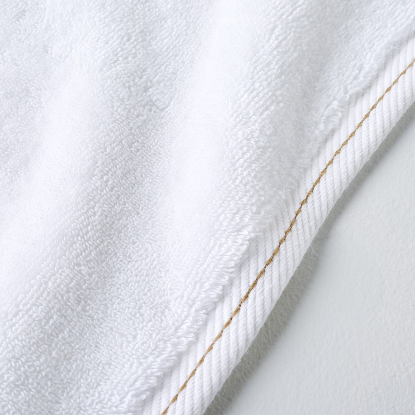 Magnolia White Plush Stitched Edge Towel up close