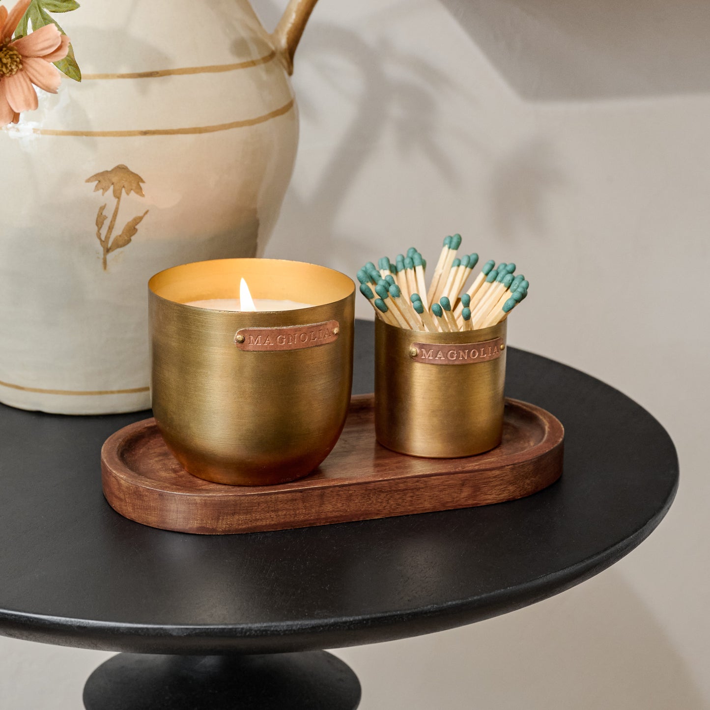 Magnolia Santalum Brass and Copper Candle Set shown on table