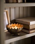 Antique Brass Footed Candle Bowl lit on shelf
