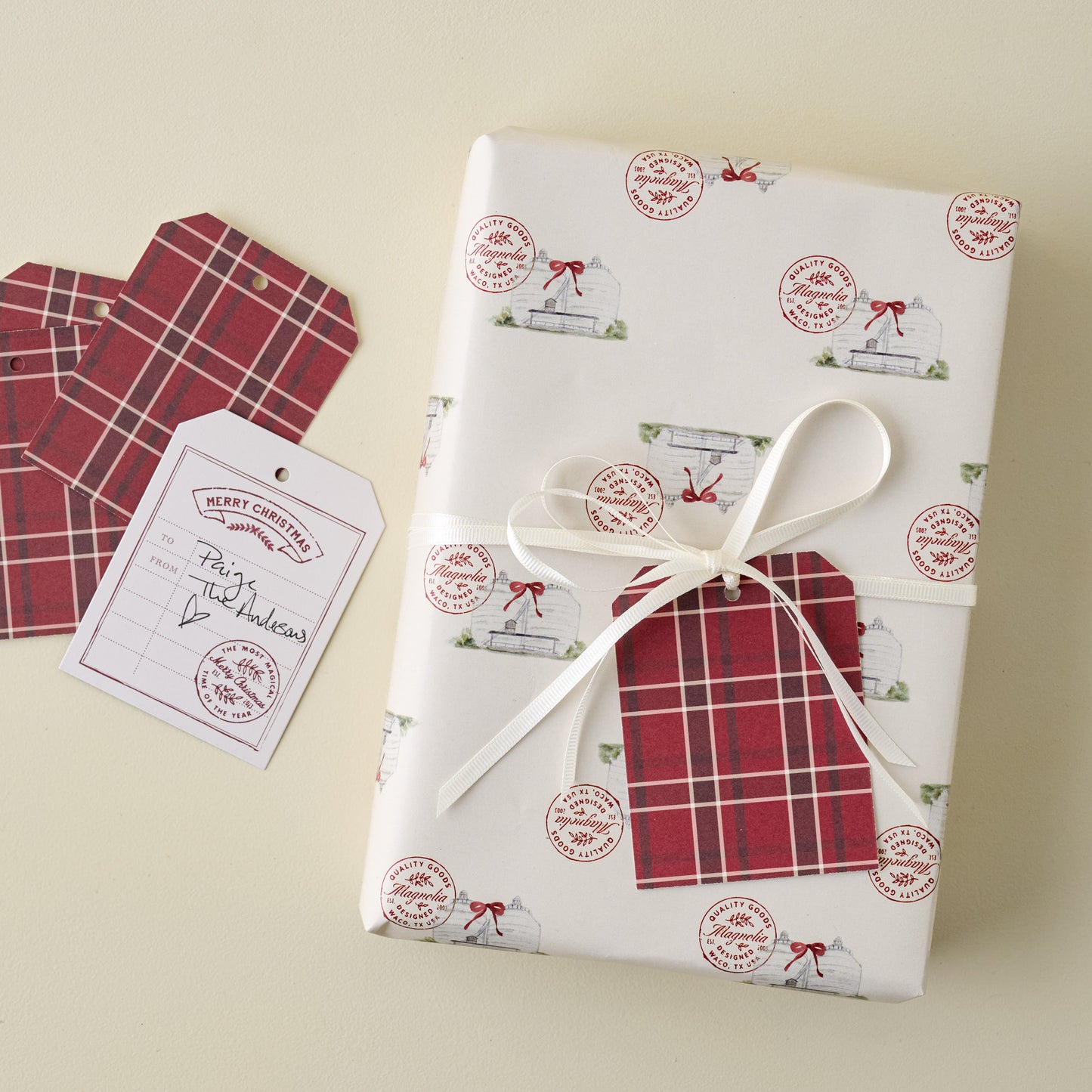 Home Again Red Plaid Wrapping Sheets shown with gift tags