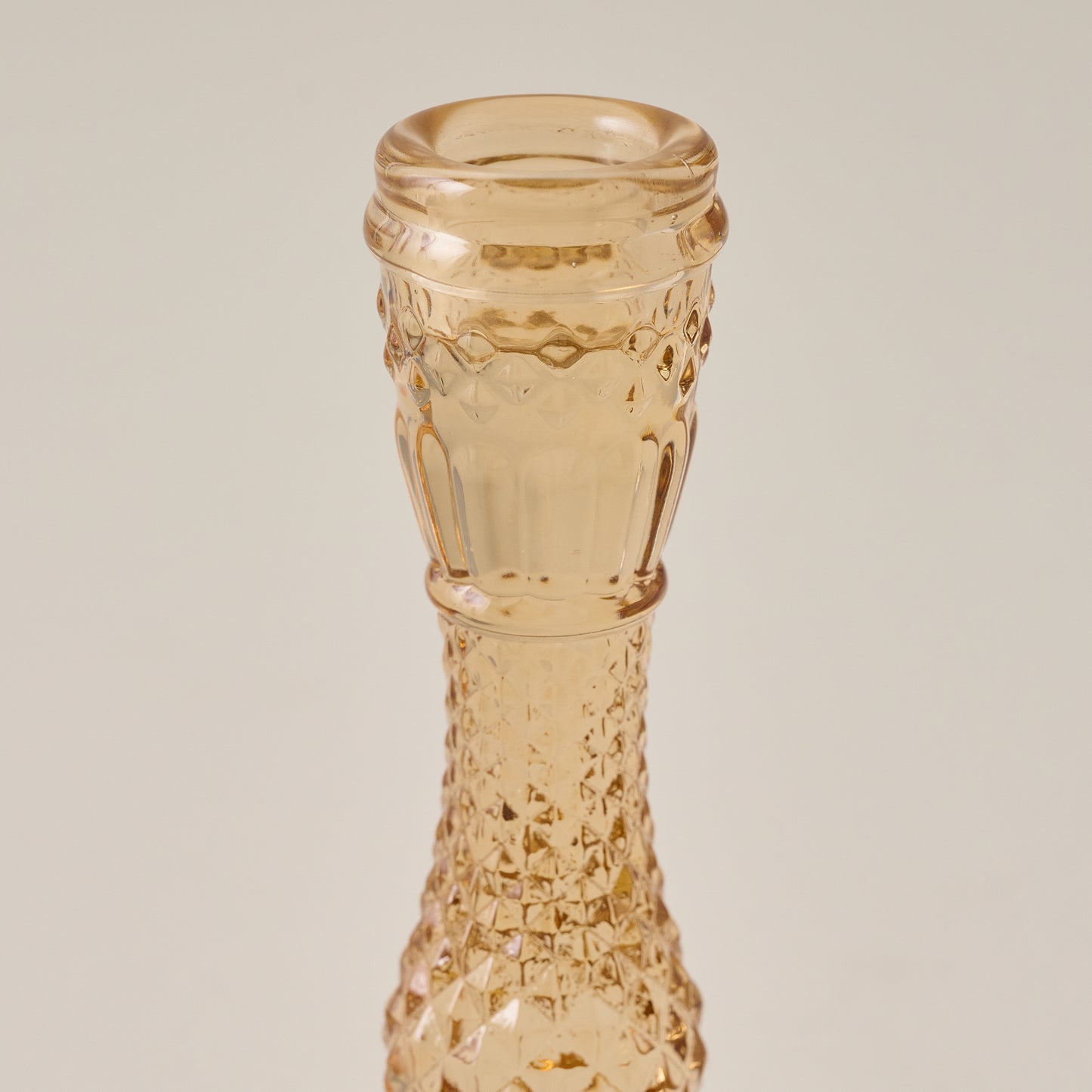 Antique Amber Glass Taper Holder up close