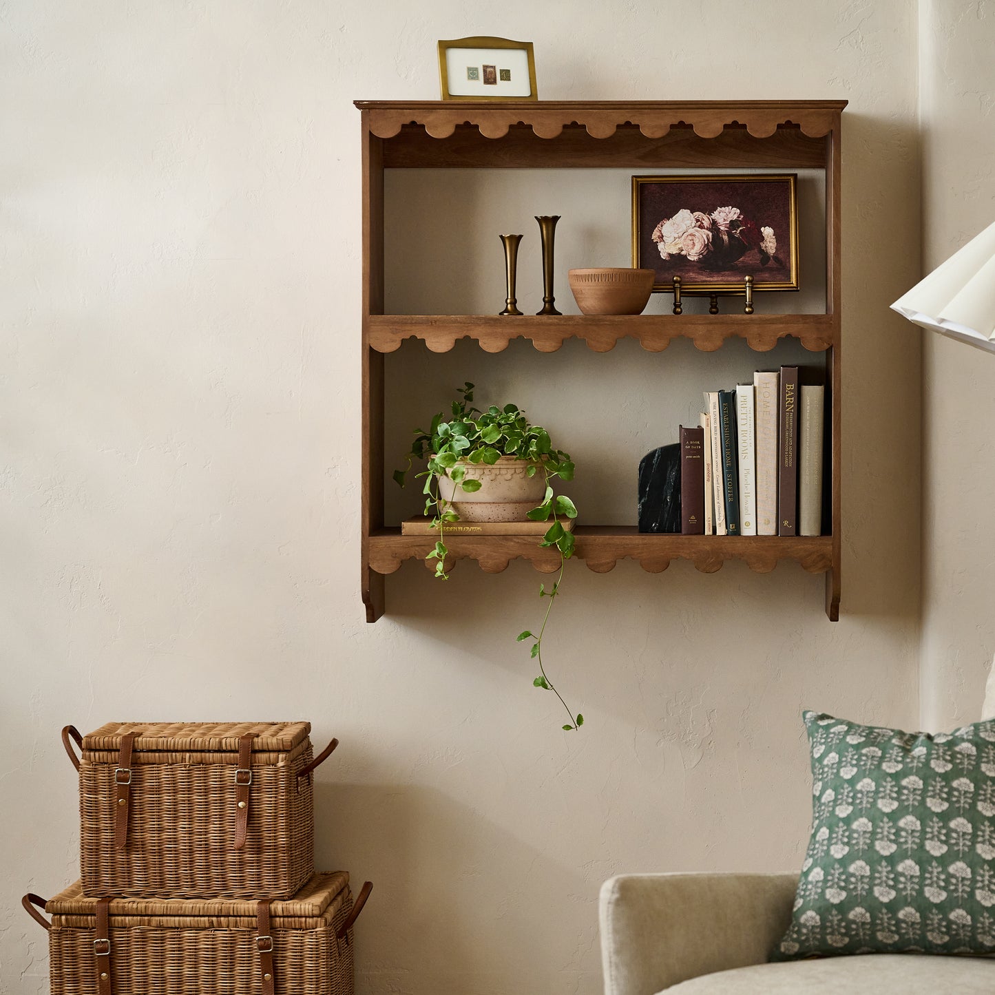 Reid Woven Storage Trunk with Leather Handles shown next to wall decor