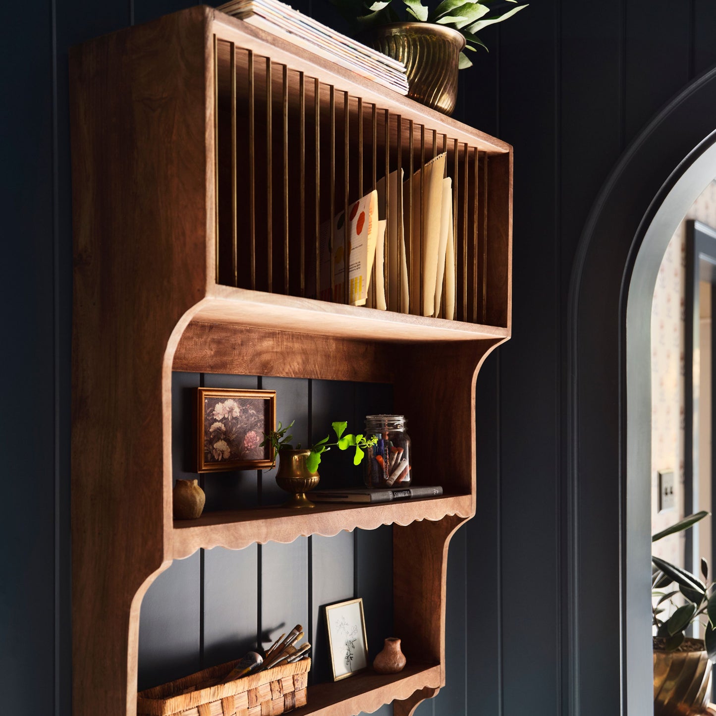 Quinn Wooden Dish Cabinet shown holding art supplies