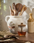 Elaine Floral Pitcher Crock with utensils inside next to honey jar