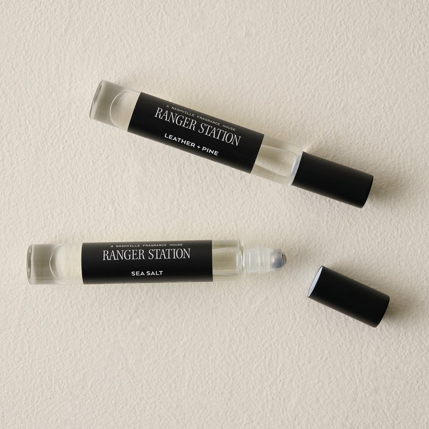 Ranger Station 10ML Leather and Pine Cologne shown with Sea Salt Cologne