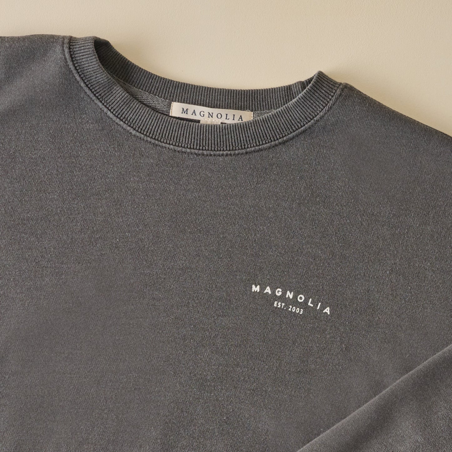 Magnolia Silos Garment Dye Washed Black Sweatshirt front graphic up close