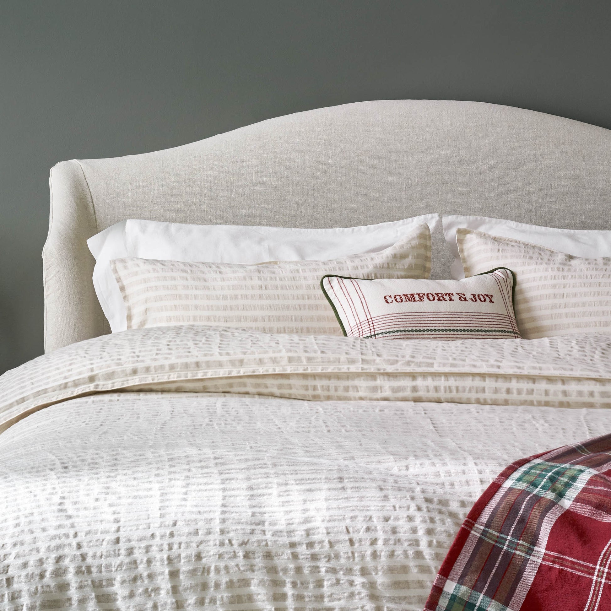 Antique White + Oatmeal Stripe Linen Cotton Duvet on a bed