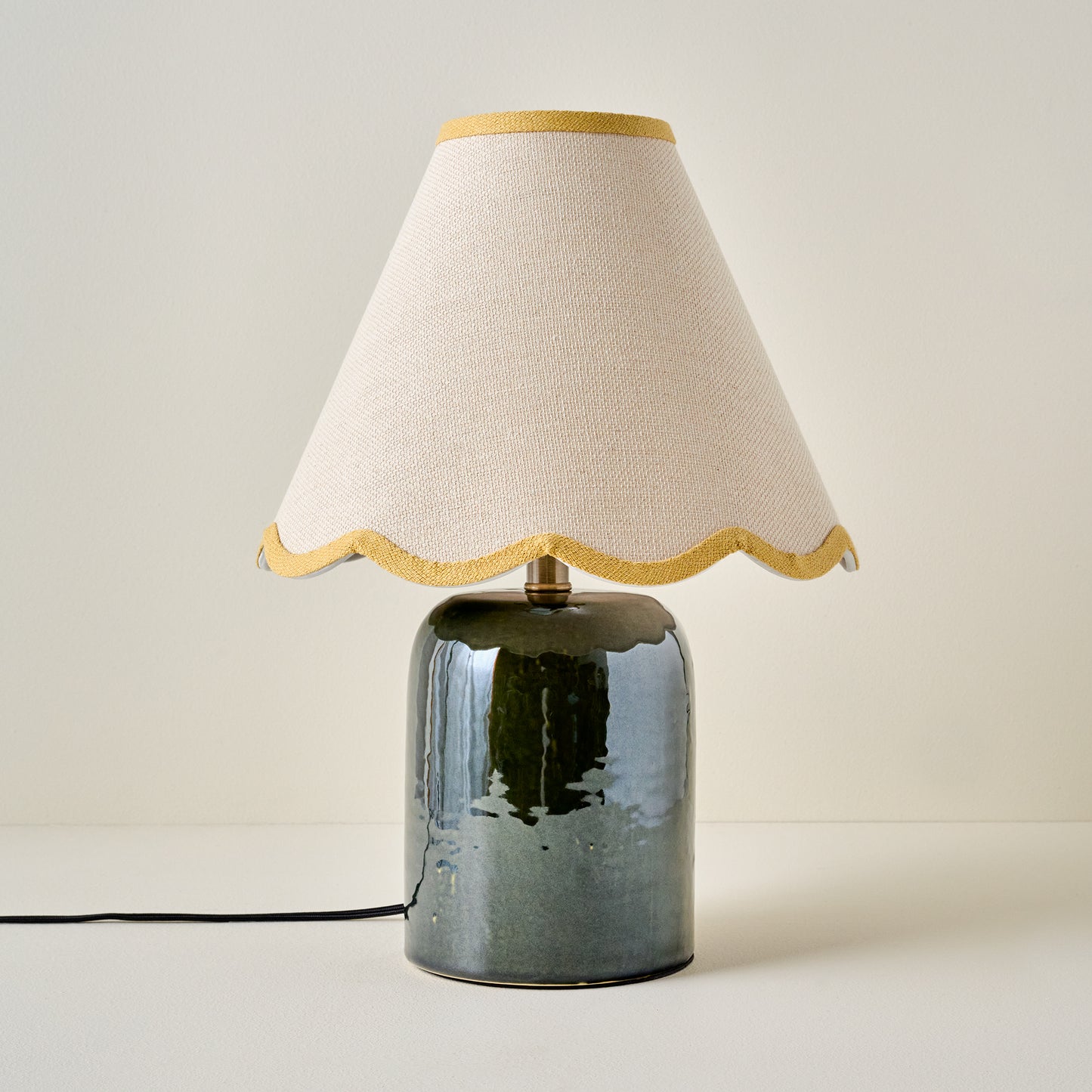 Farrah Table Lamp - Textured Green shown with mustard yellow wavy lamp shade