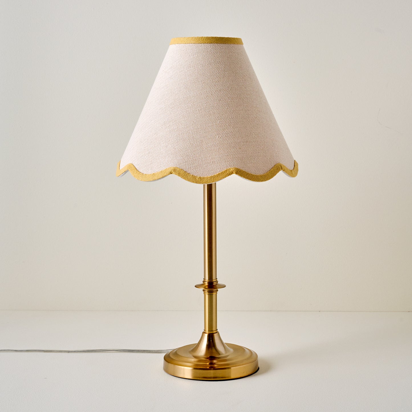 Carmen Brass Table Lamp with yellow wavy linen shade
