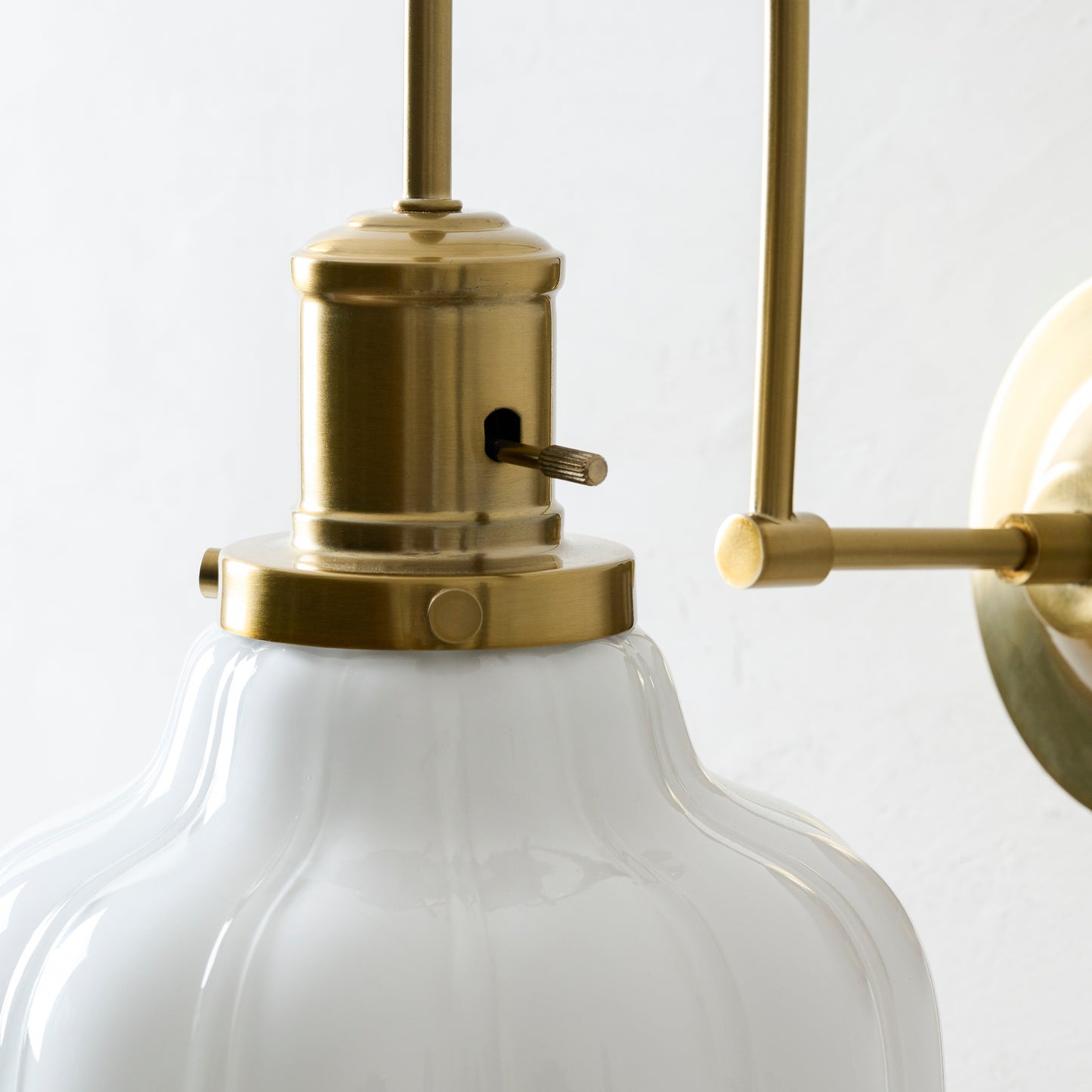 Polly Milk Glass Plug-in Sconce up close