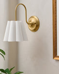 Fluted Scallop Hardwired Wall Sconce in a room