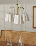 Fluted Scallop Chandelier in a room over dining table