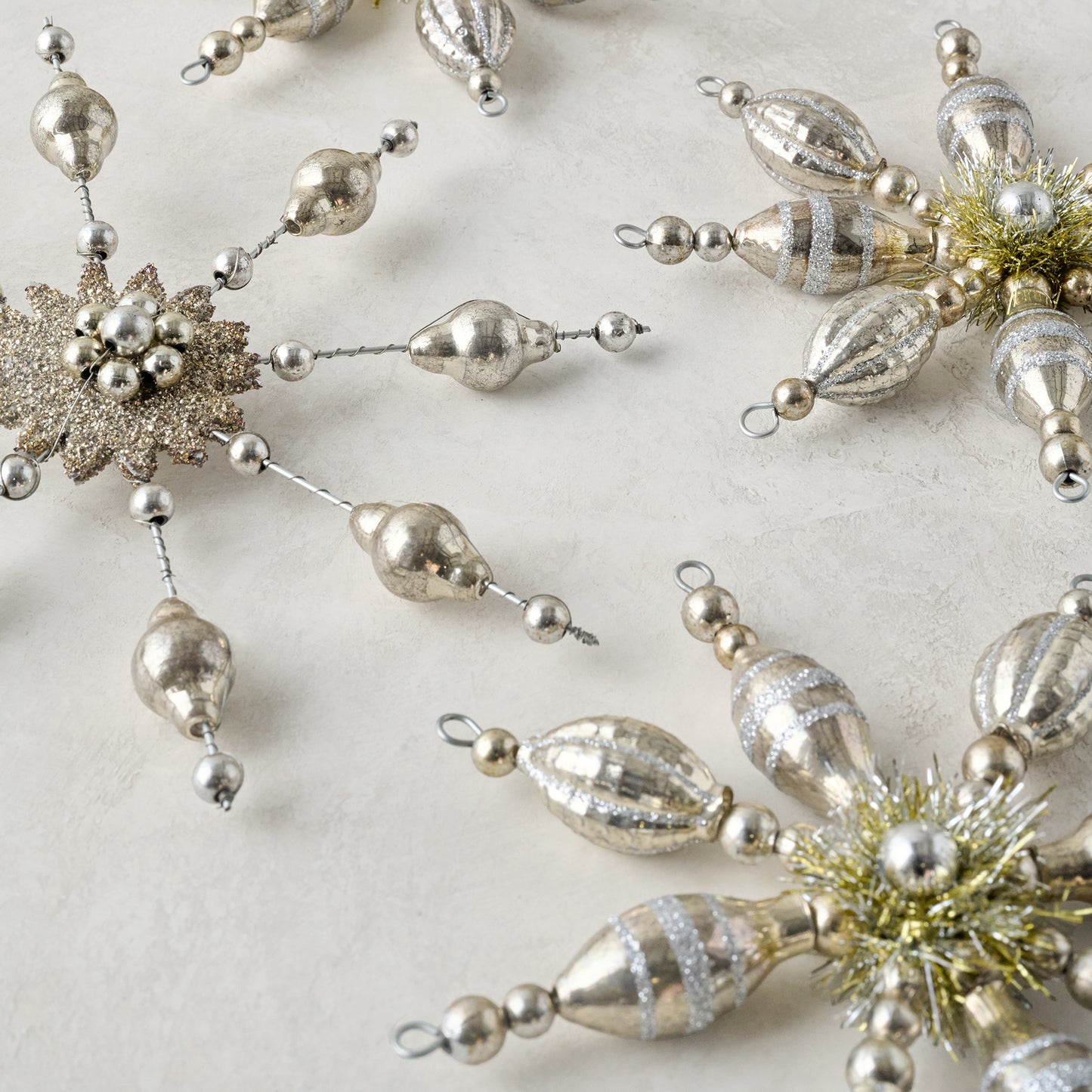 Mercury Glass Beaded Snowflake Ornament shown with other ornaments