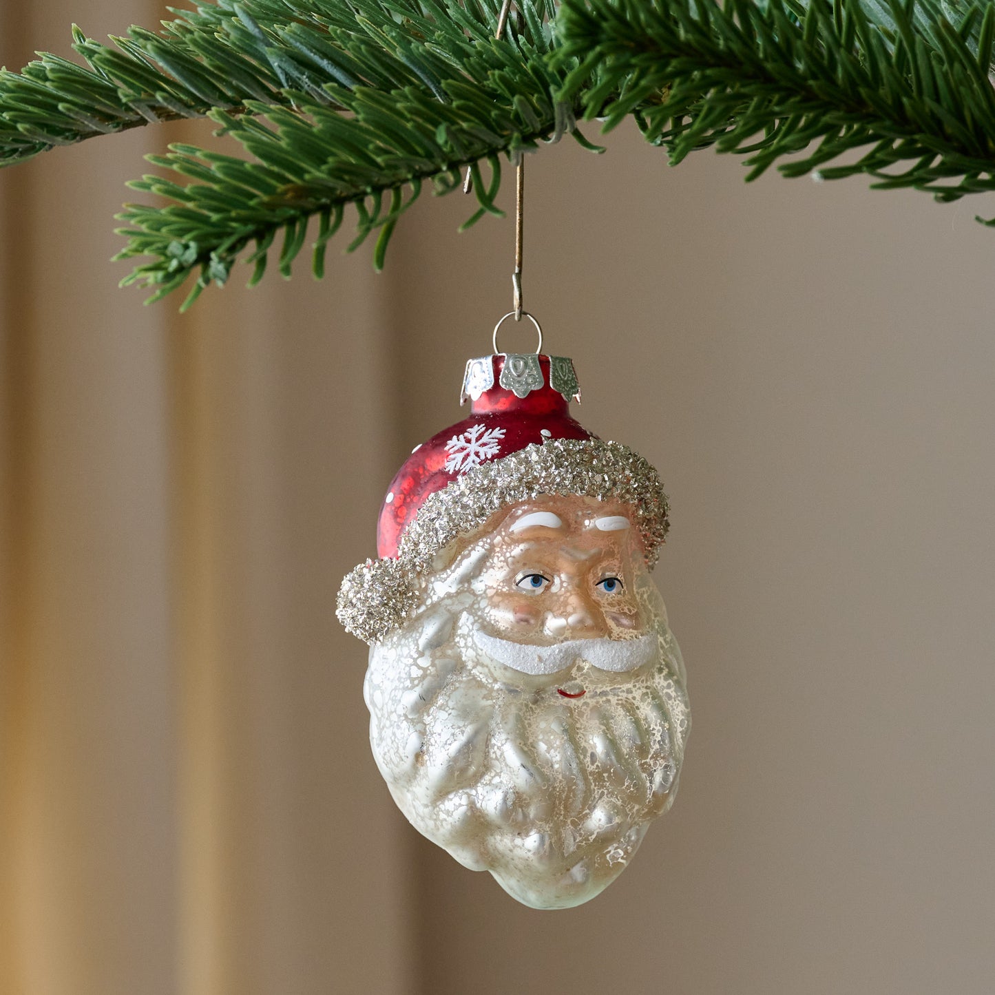 Vintage Blown Glass Santa Ornament shown on tree