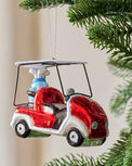 Glass Golf Cart Ornament shown hung from tree