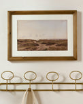 Coastal Reverie shown hung above wall hooks
