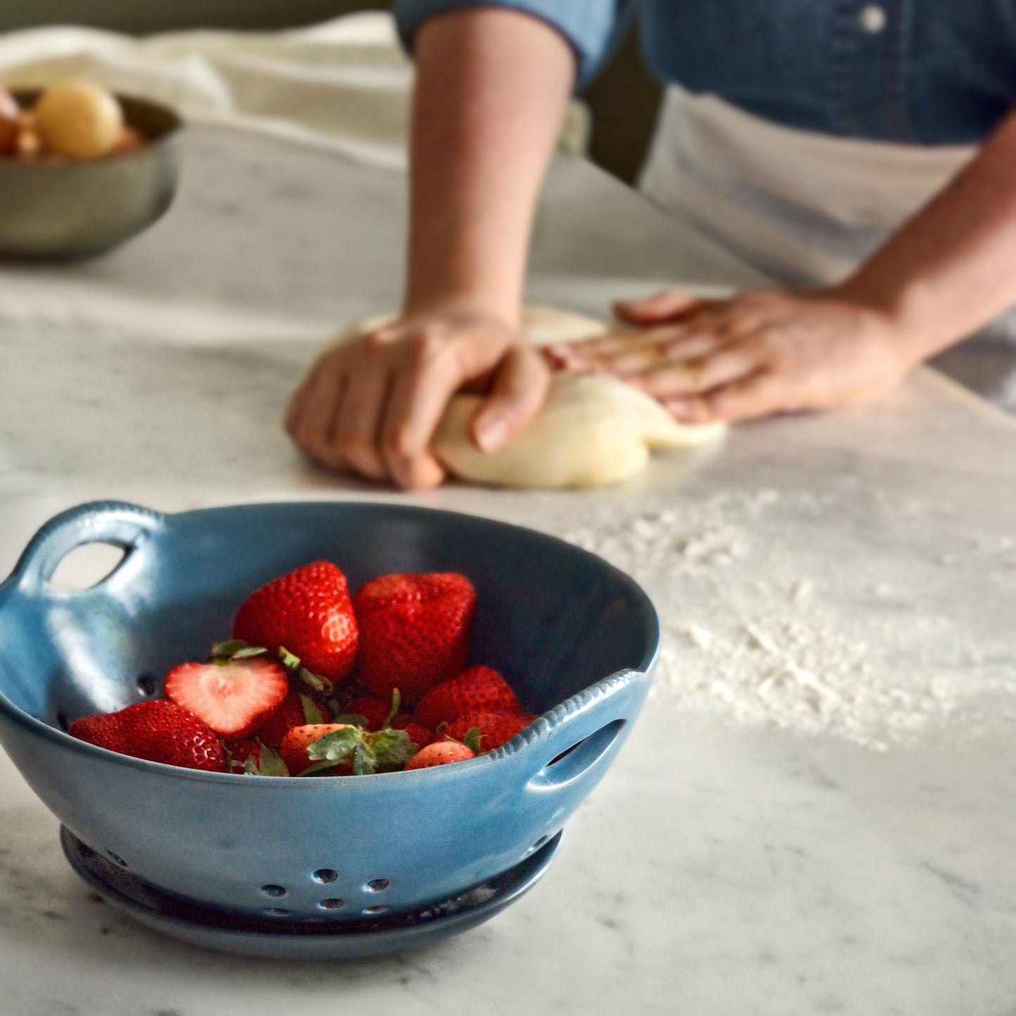 Maribel Stoneware Colander + Plate on a counter