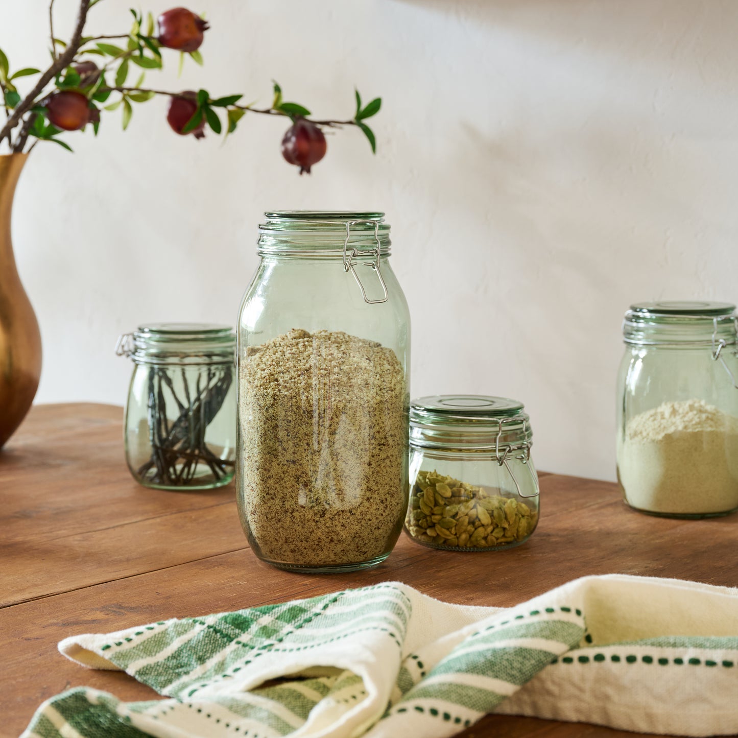 Magnolia Green Glass Storage Jars shown styled