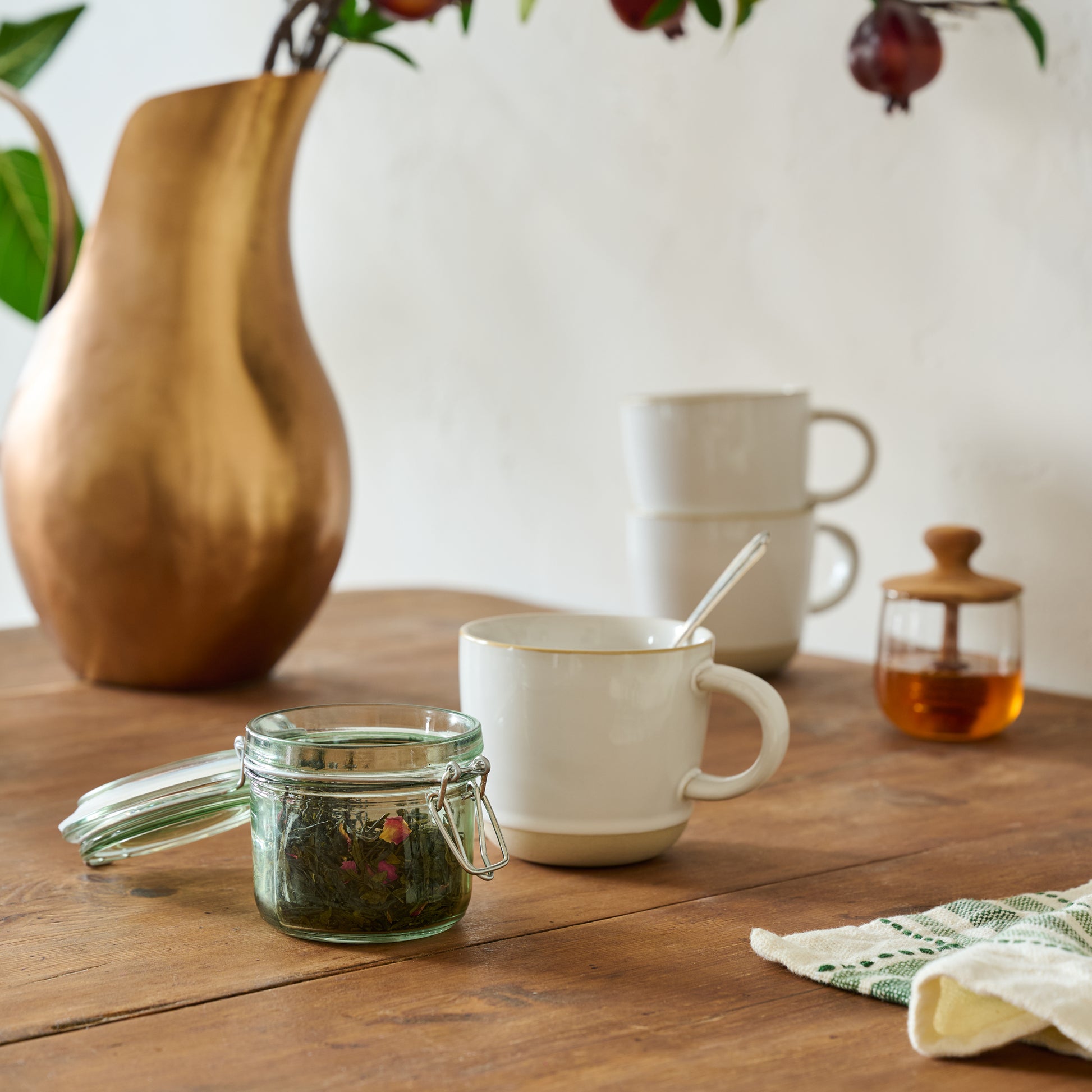 Extra Small Magnolia Green Glass Storage Jar shown styled
