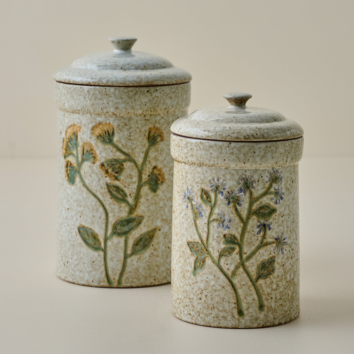 Blue Wildflower Canister shown with canister with yellow wildflowers