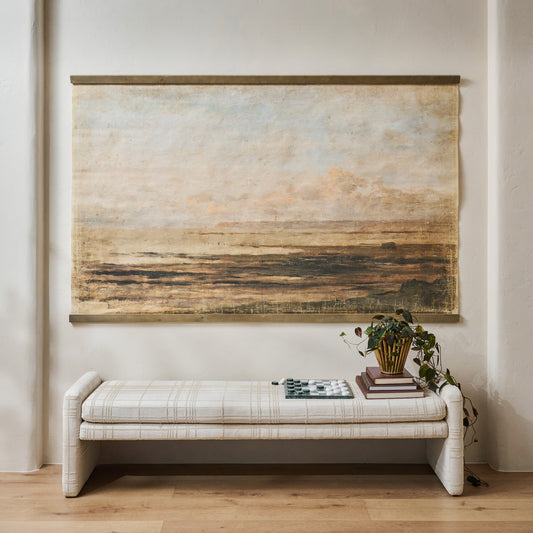 Oversized Hues of Dusk Tapestry shown hung above bench
