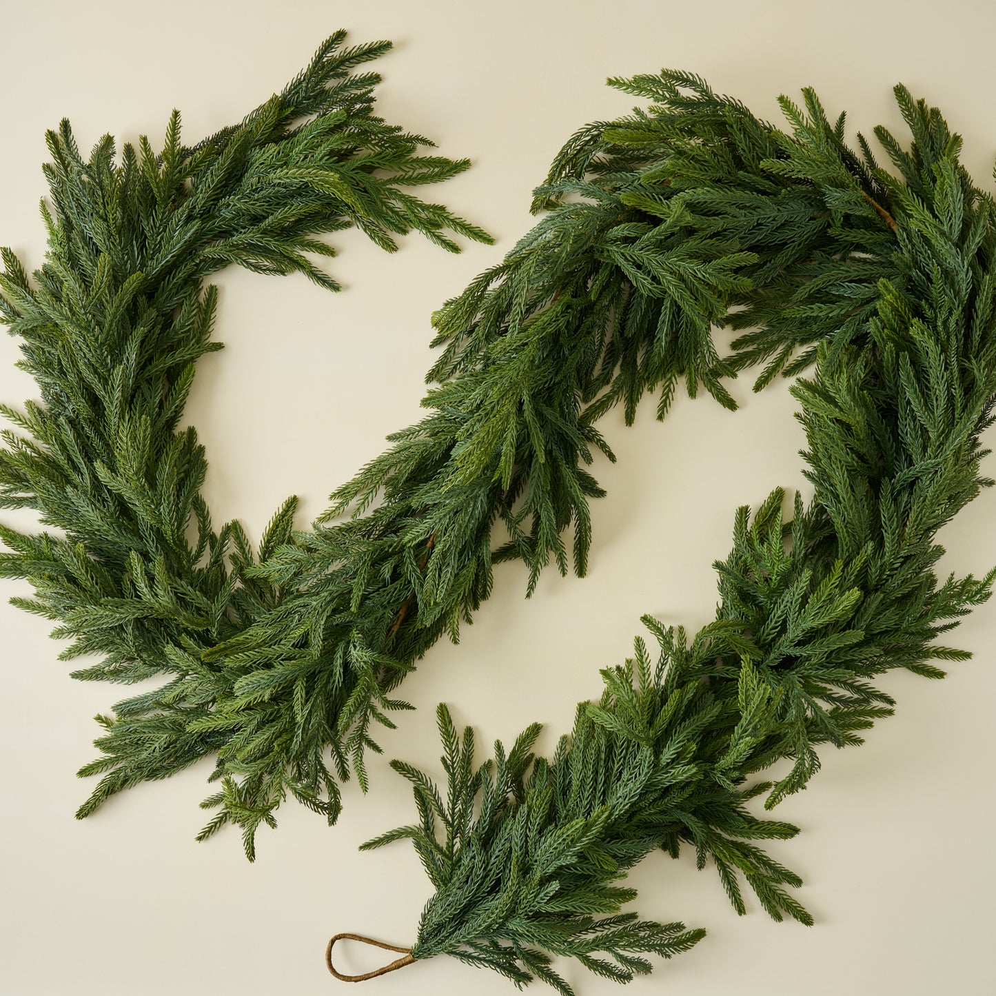 Real Touch Oversized Norfolk Pine Garland on beige background