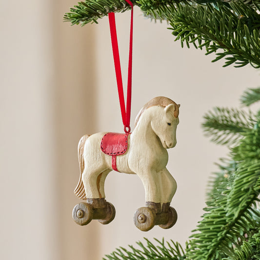 Vintage-Inspired Rocking Horse Ornament shown hung from tree