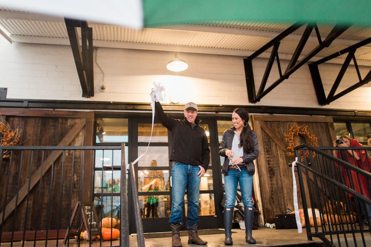Chip and Joanna Gaines doing a ribbon cutting at the grand opening of Silobration.