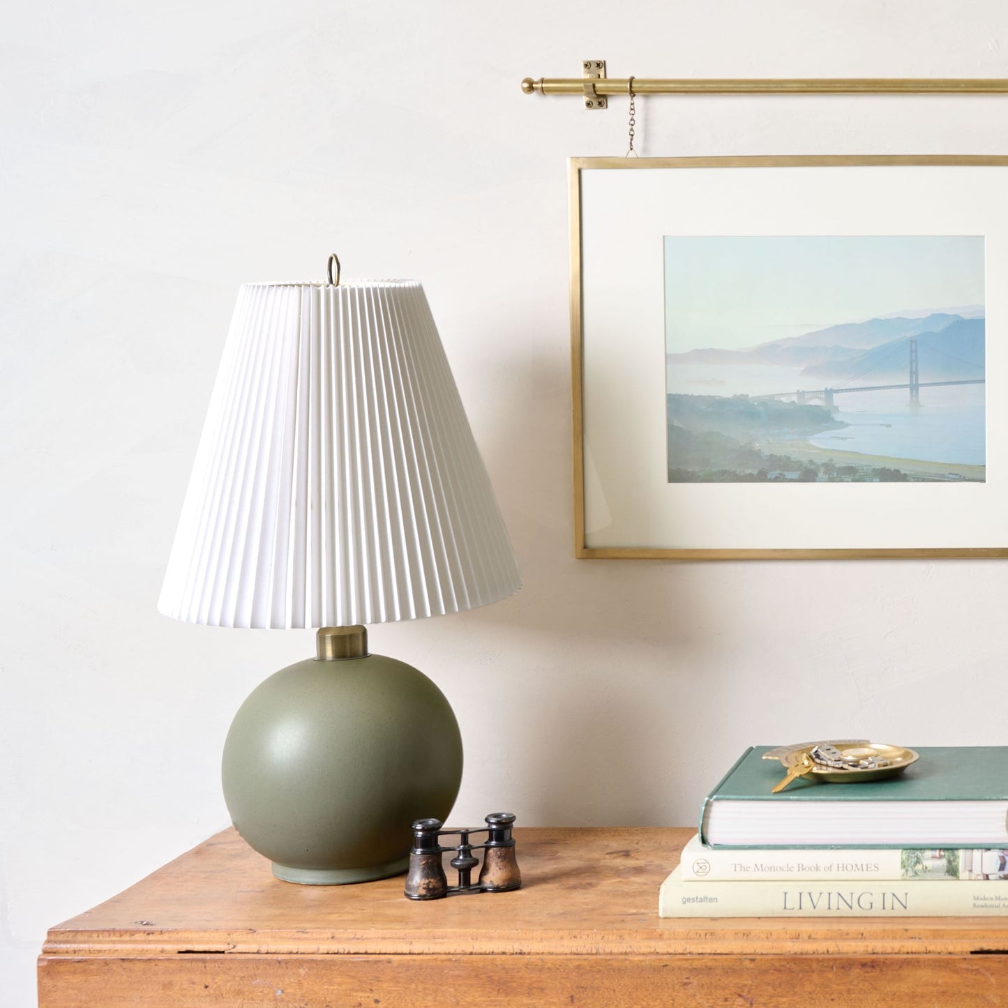 Corrie Accordion Shade Table Lamp set on dresser