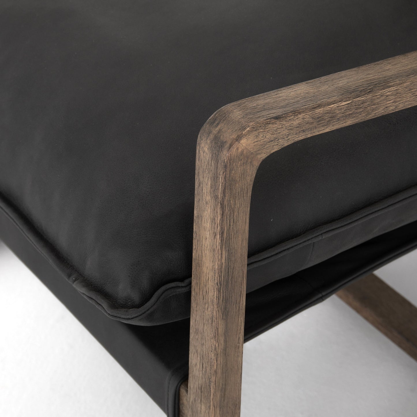black leather arm chair with wooden show frame
