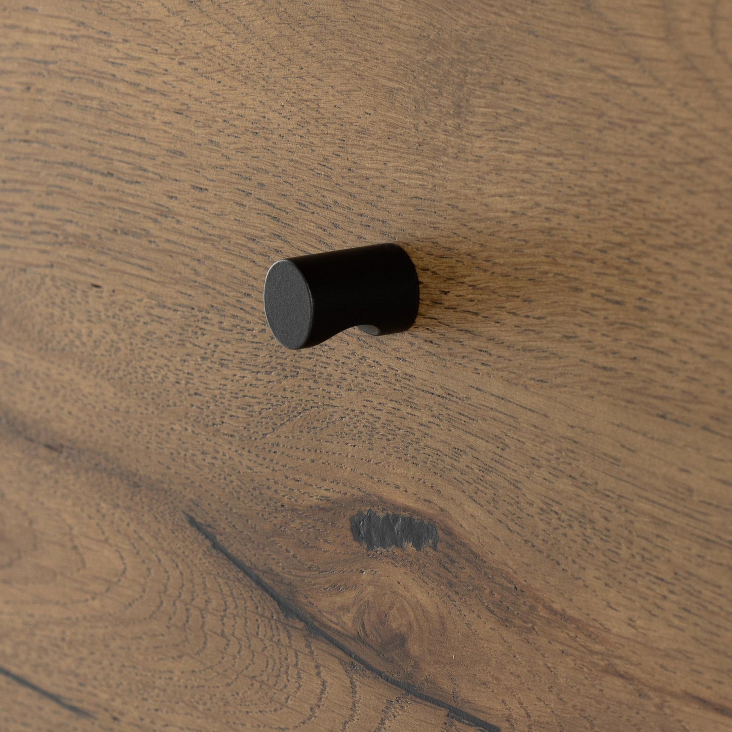 Liam 5 Drawer Dresser in amber oak close up of pull knob