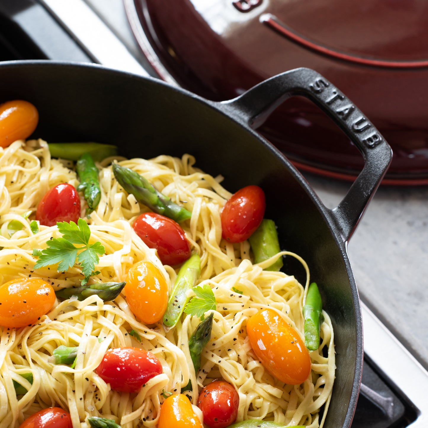 staub lidded cast iron braiser in grenadine red