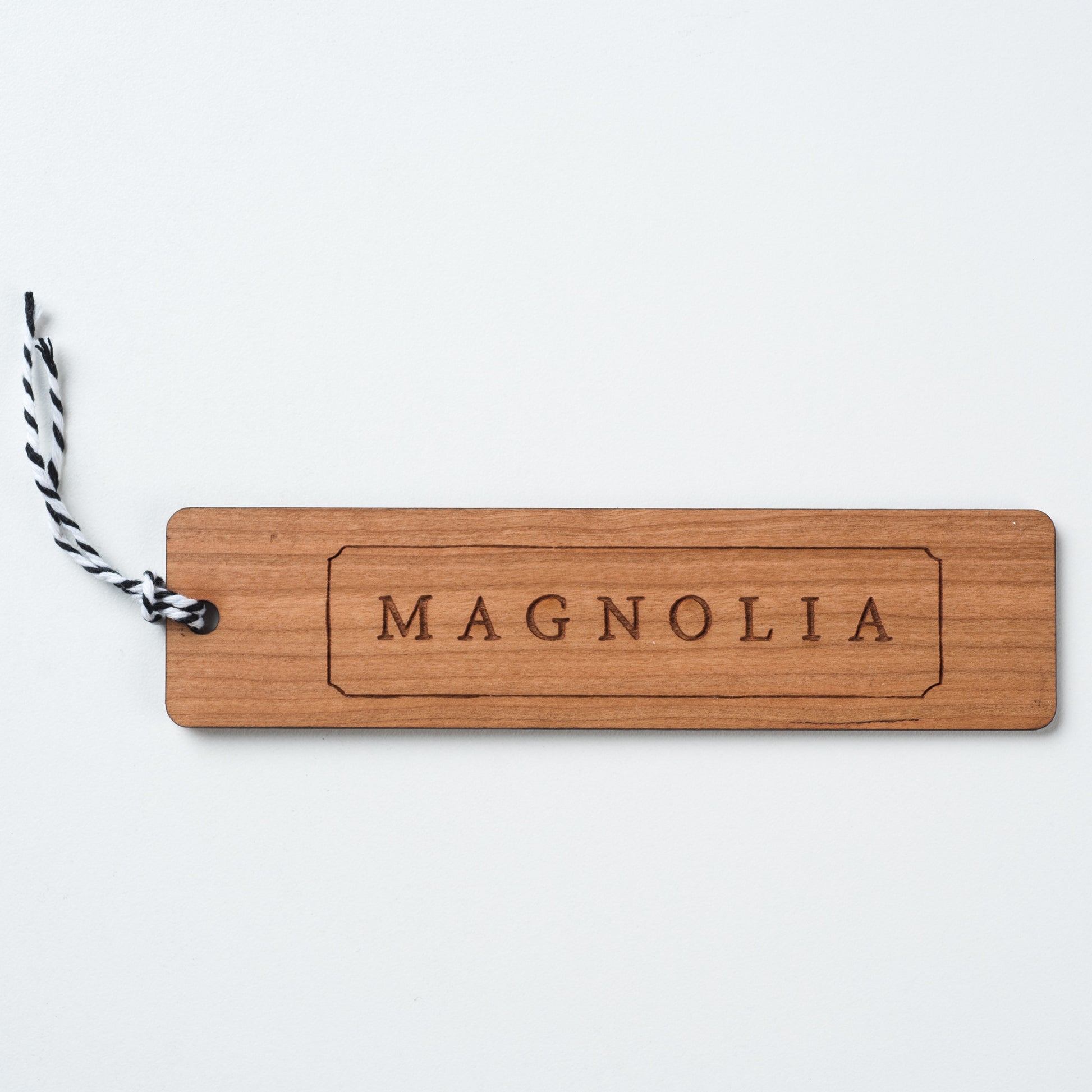 wooden bookmark with magnolia logo