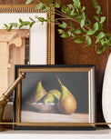 Framed wall art called Poires Conferences by Pascal Giroud on shelf