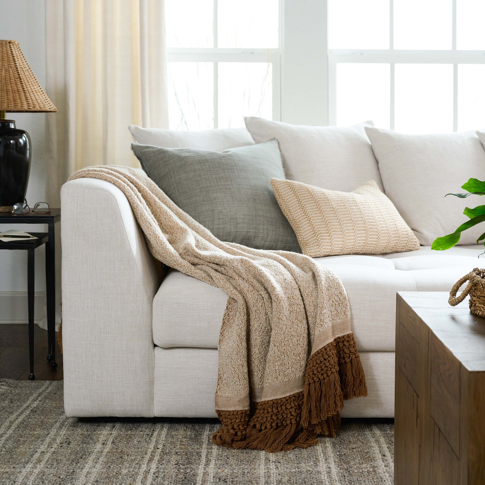 Adobe tassel throw on white sectional couch