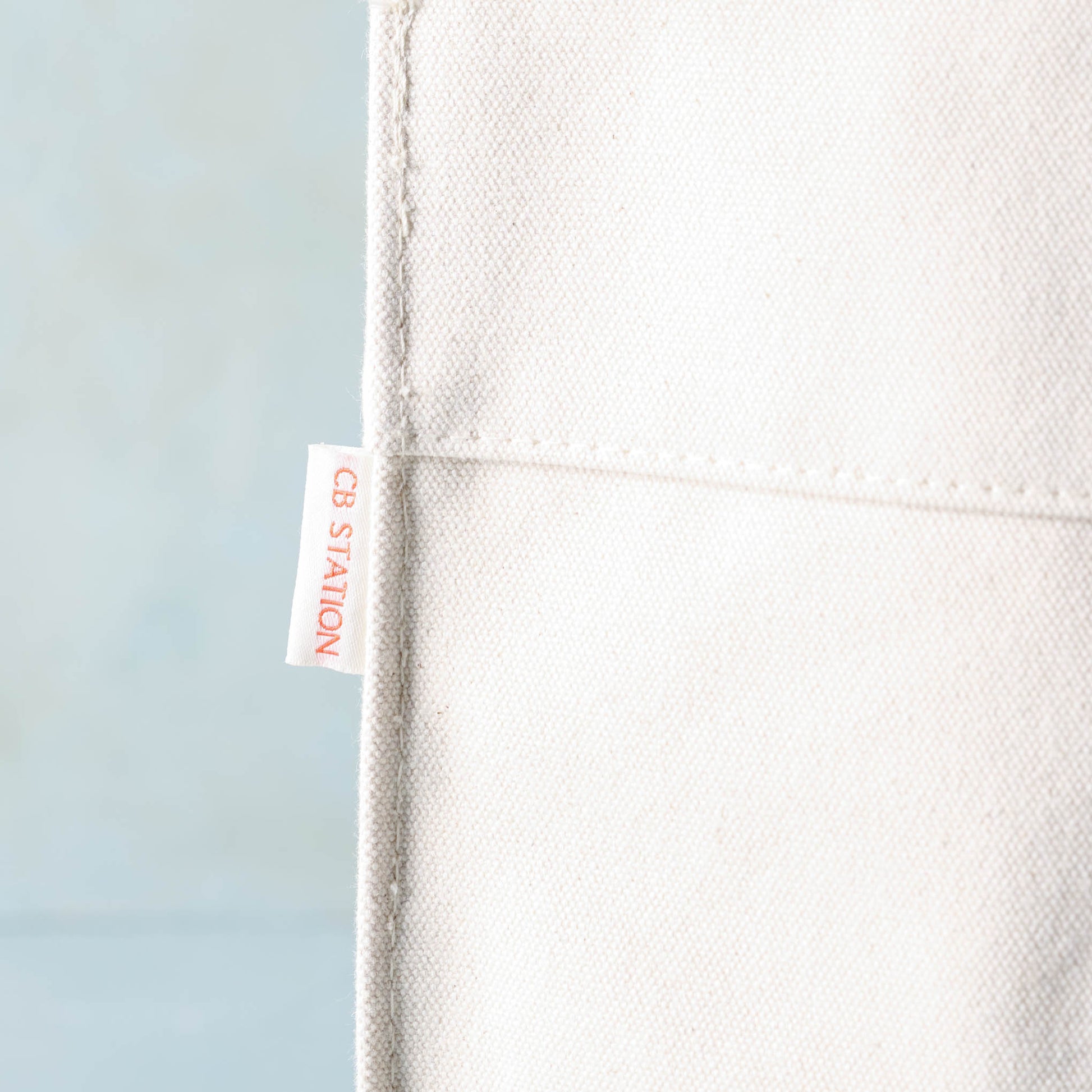 close up of CB Station tag on Magnolia Cora Script Large Canvas Tote