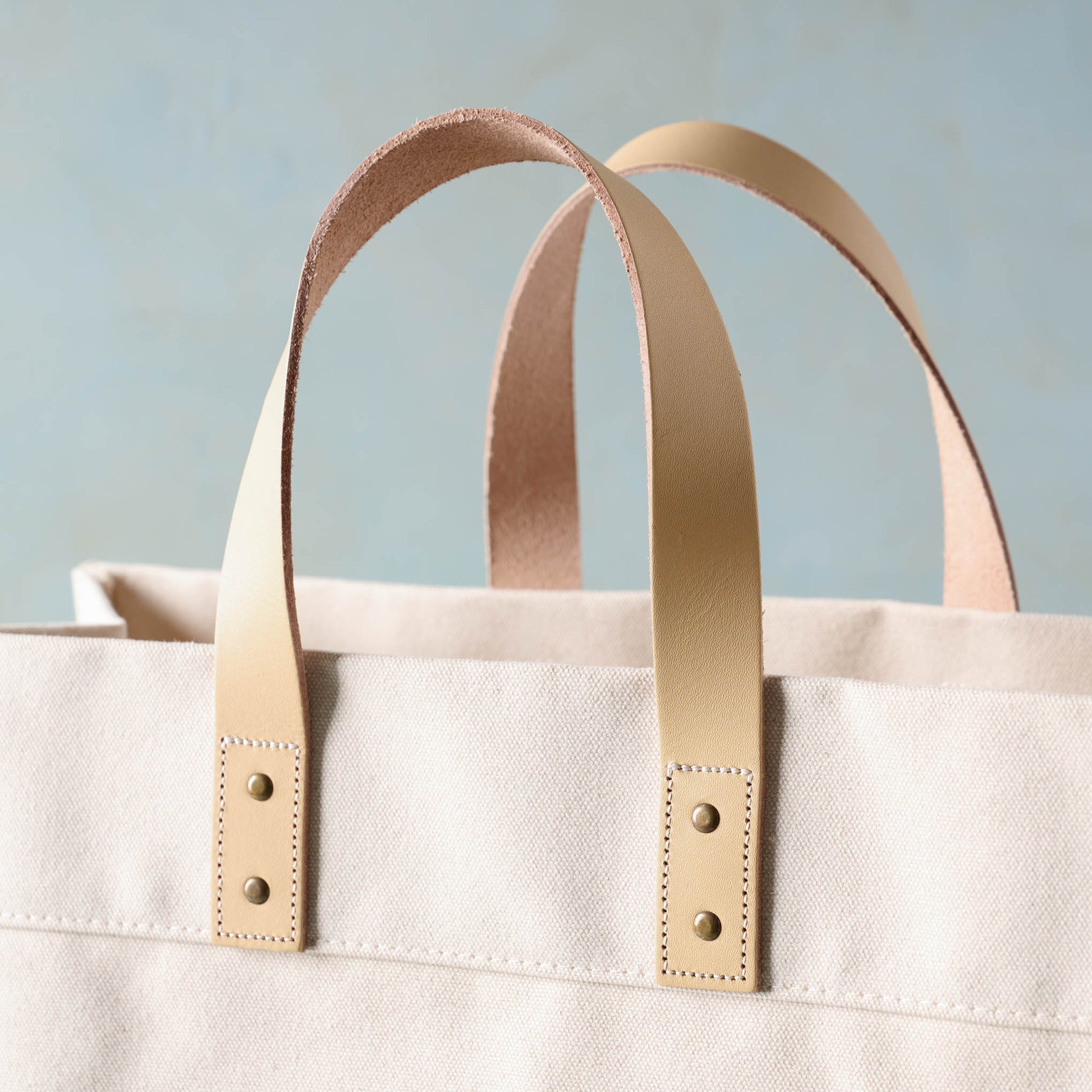 Close up of handles on Magnolia Cora Script Large Canvas Tote