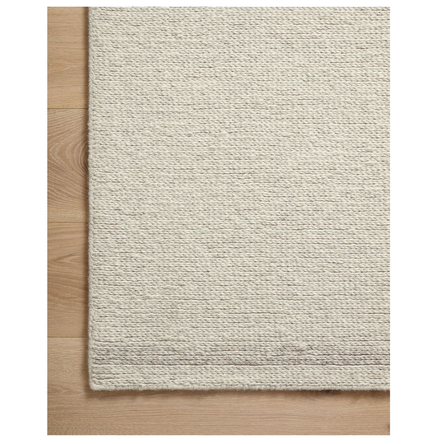 Ashby Mist Silver Rug corner on wood floor