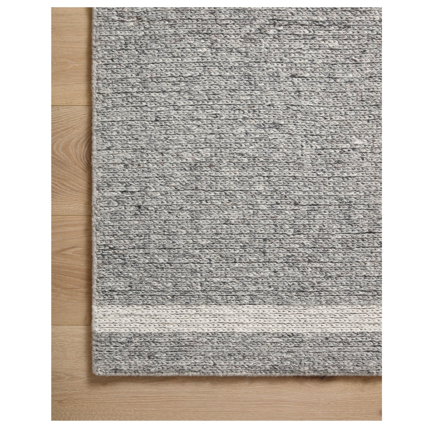 Ashby Slate Ivory Rug corner on wood floor