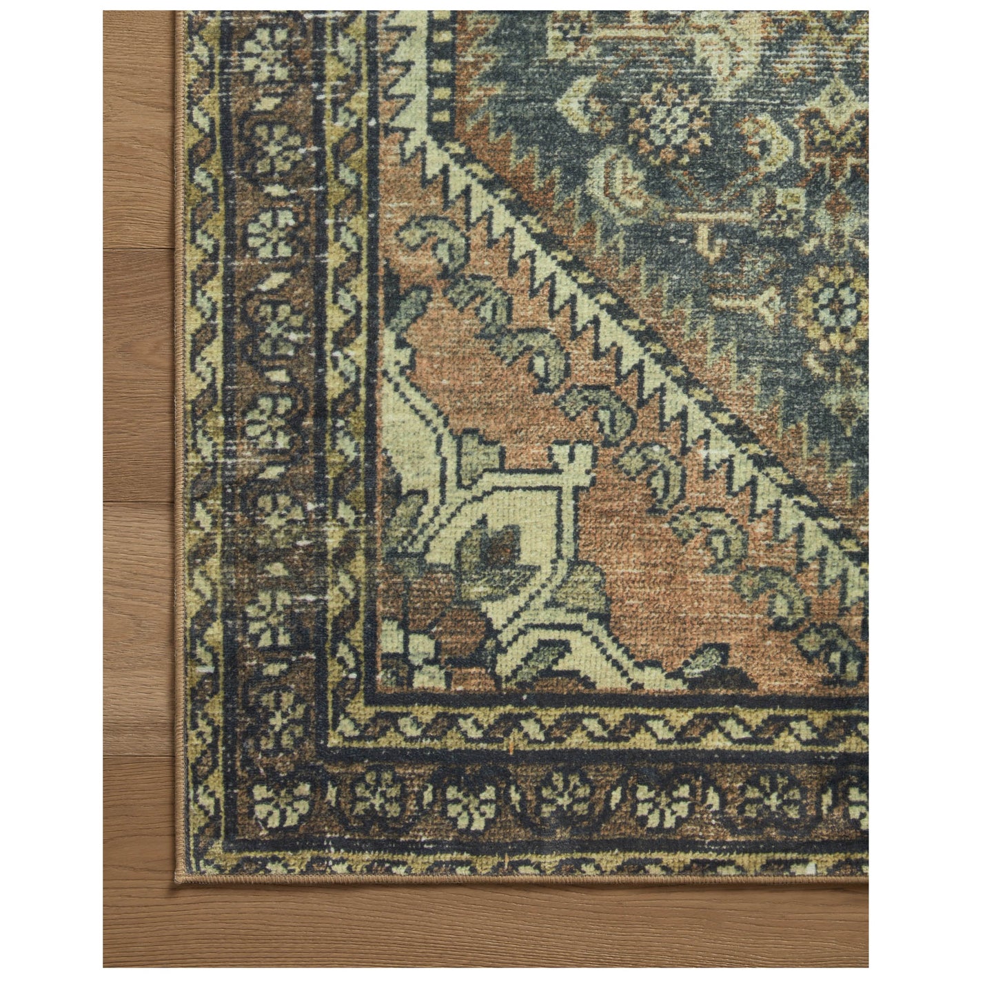 Banks Denim Clay Rug corner on wood floor