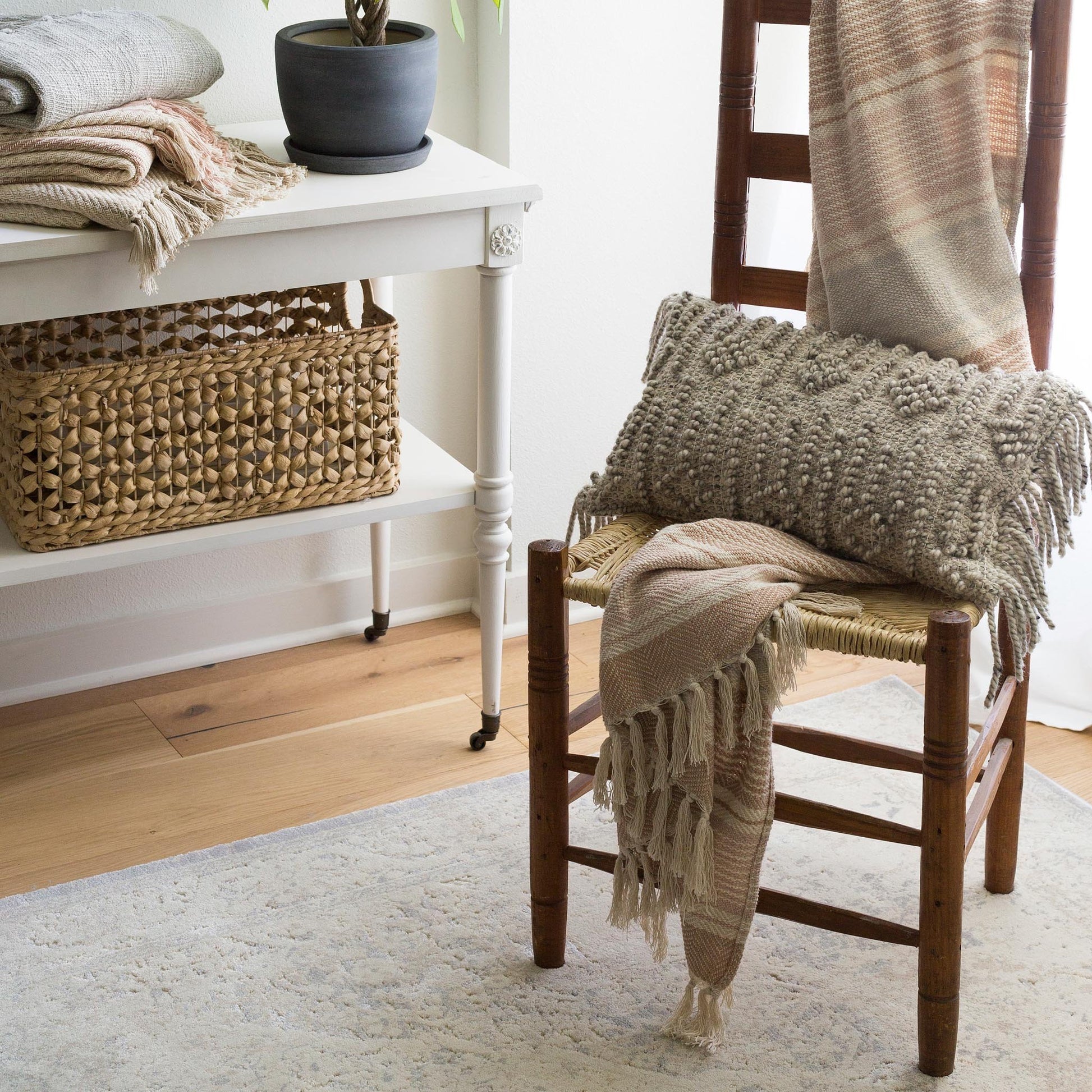 pale cream and grey distressed rug with faint floral detail