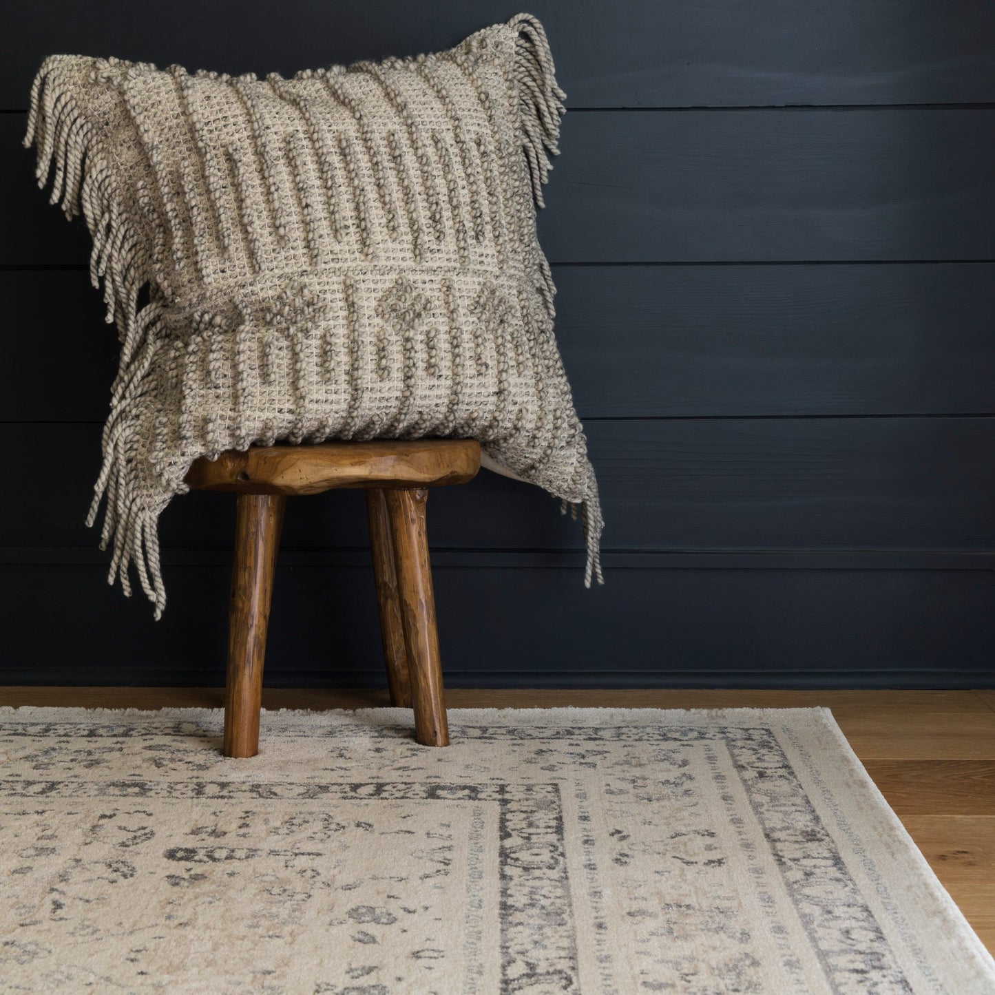 ivory and tan distressed rug with floral detail